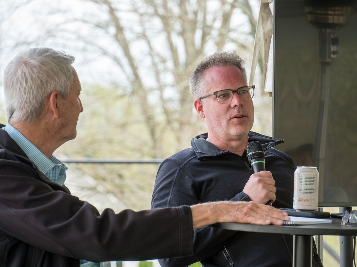 Jeremy Pryor in conversation with an elder father at an Integrated meetup